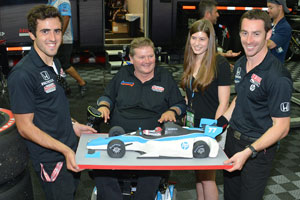 Simon Pagenaud and Tristan Vautier present Sam Schmidt a custom cake