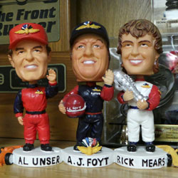 Bobbleheads of the three four-time Indy 500 winners
