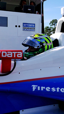 Tony Kanaan sits in his car