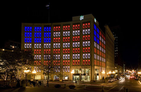 The IPL Building is lit up like the American flag