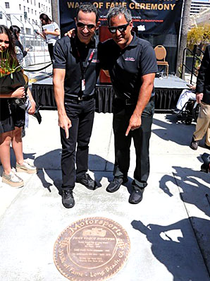 Helio Castroneves and Juan Pablo Montoya with their plaque on the Walk of Fame.