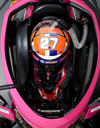 Alexander Rossi sitting in his No. 27 AutoNation / NAPA AUTO PARTS Honda at COTA.