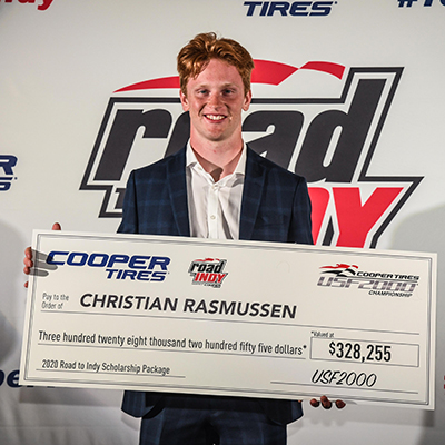 Christian Rasmussen and his champion's scholarship check.