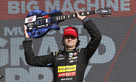 Herta lifts the unique trophy from the Big Machine Music City Grand Prix over his head