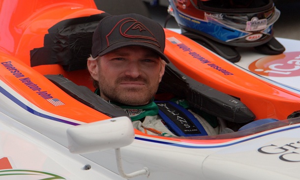 Emerson Newton-John sits in his car at Indianapolis Motor Speedway
