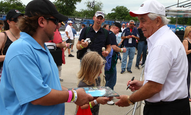 Roger Penske signs autographs