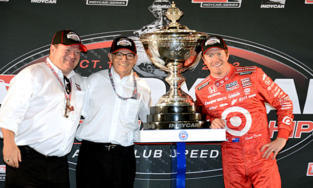 Chip Ganassi, Mike Hull and Scott Dixon celebrate the 2013 IndyCar Series title.