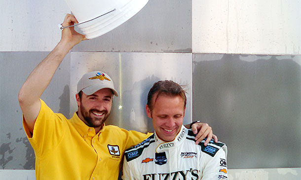 With an assist from James Hinchcliffe, left, Ed Carpenter accepted the ALS Ice Bucket Challlenge.