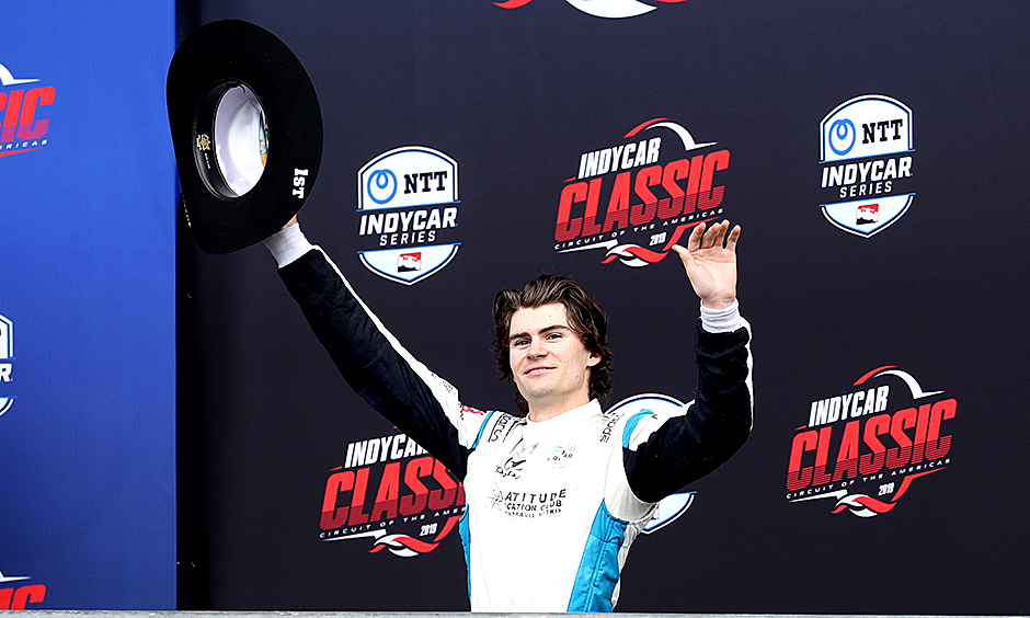Colton Herta celebrates on the grid