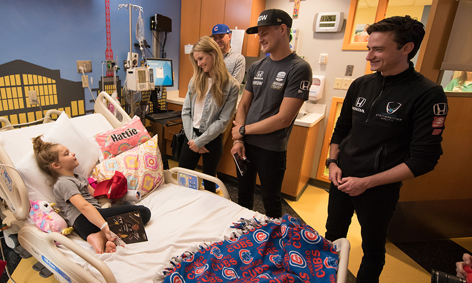 Becky Dalton, Marcus Ericsson, George Steinbrenner IV visit Peyton Manning Children's Hospital