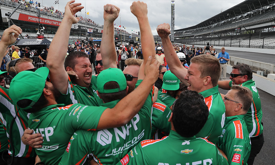 Juncos Racing crew celebrates Kyle Kaiser qualifying run