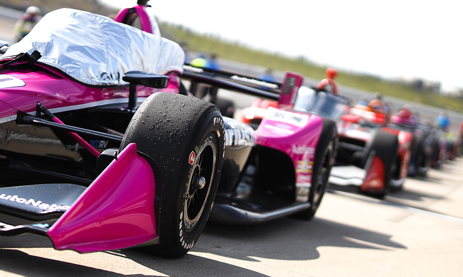 Cars waiting in line before practice.