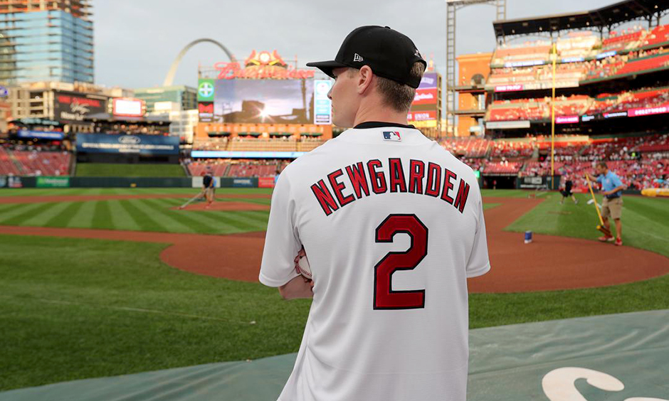 Josef Newgarden throwing out first pitch at a St. Louis Cardinals baseball game.